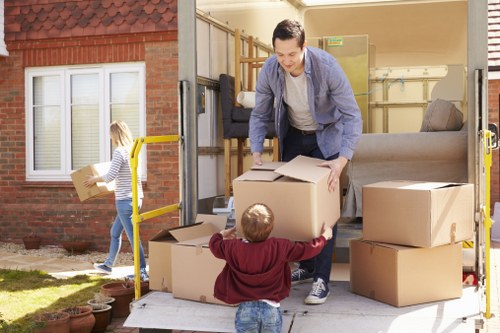 Moving van and packed boxes for removals in Loxford