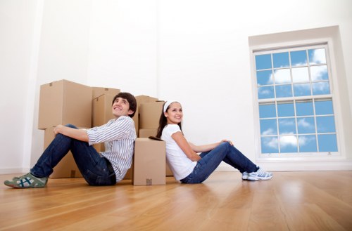 Professional movers handling furniture for small removals in Loxford