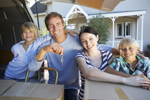 Removal van and moving team preparing a local move in Loxford