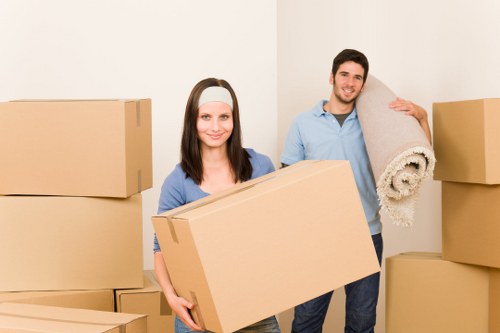 Packed boxes and furniture ready for a residential move in Loxford