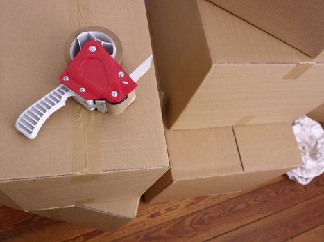 University student organizing belongings for storage